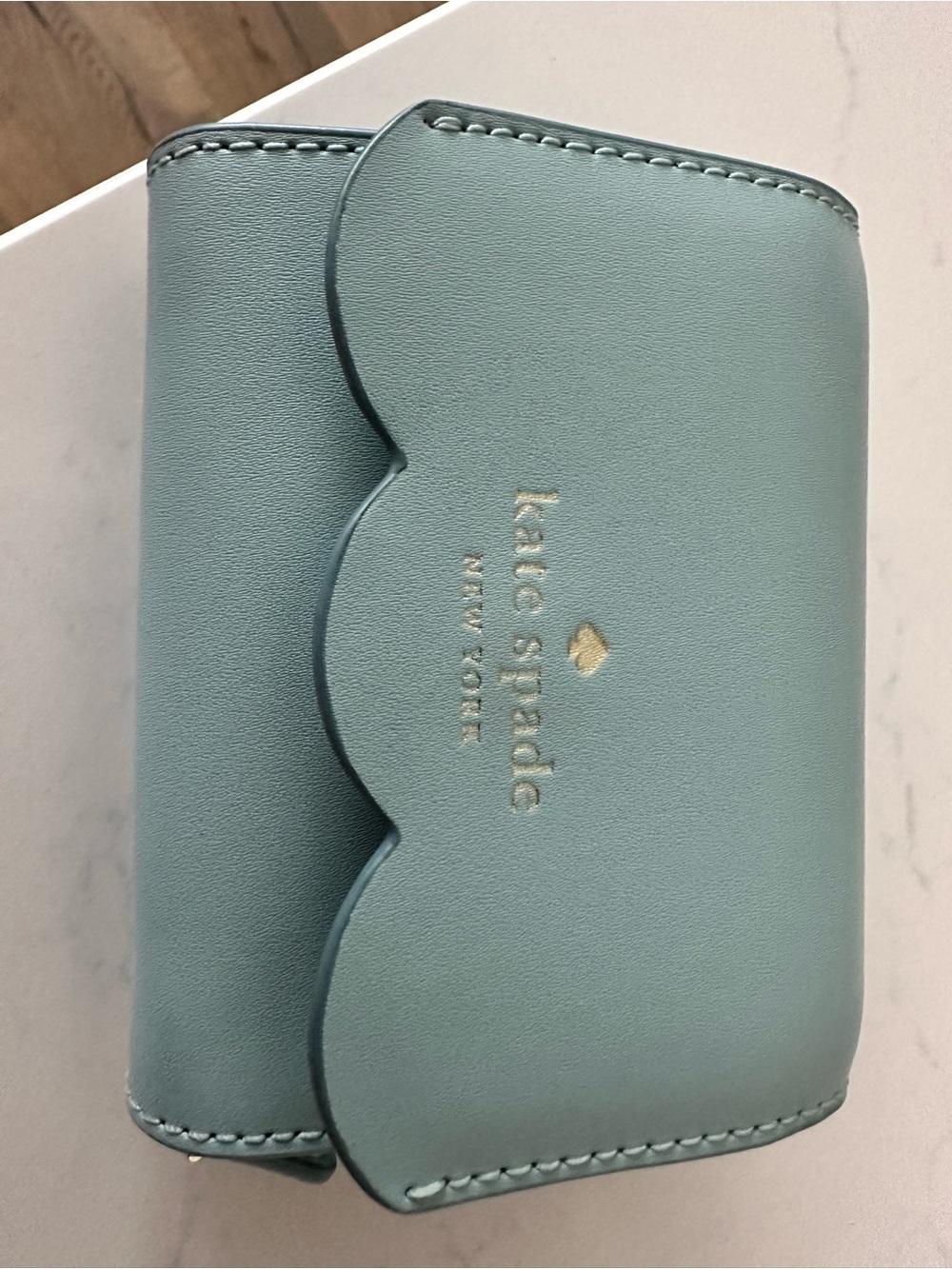 kate spade Scalloped Compact Wallet in Sage Blue with Gold Logo